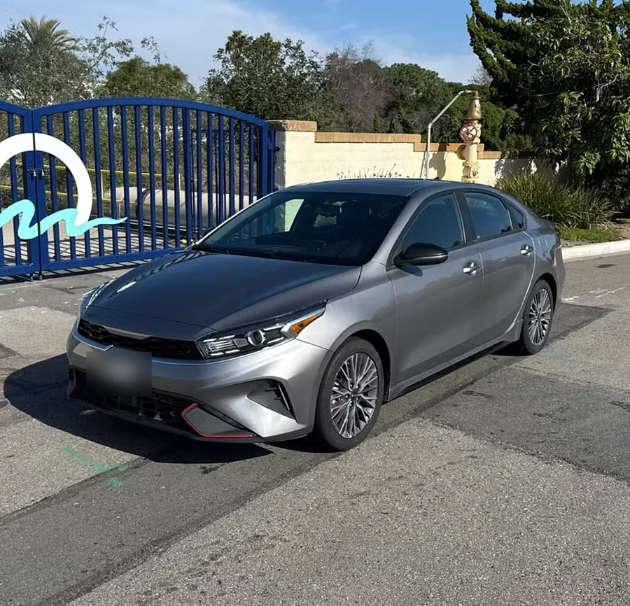 Silver Kia Forte sedan from the Evolution Auto Sale rental fleet